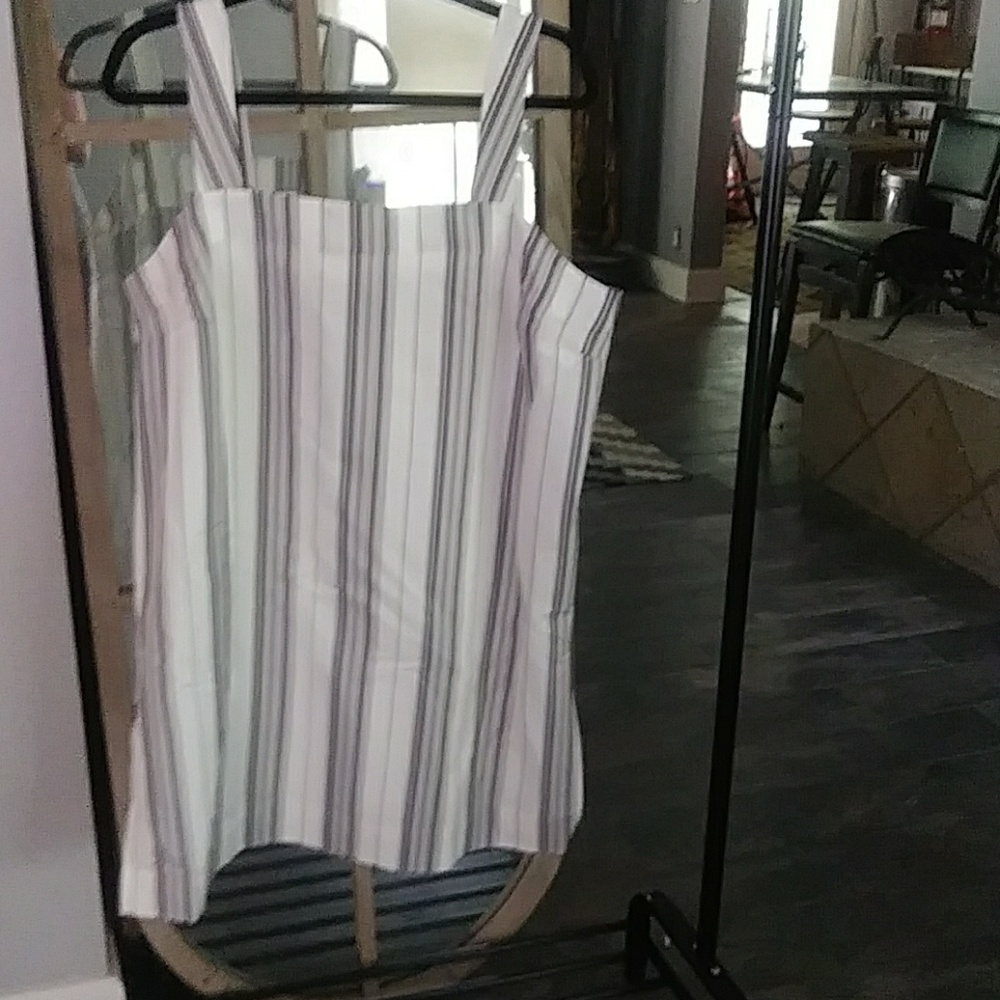 Sun dress made of black, grays and white stripes.